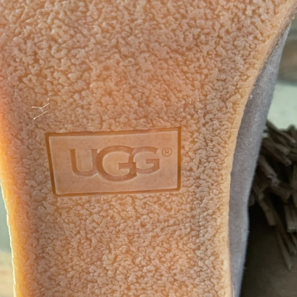 UGG sz 9 taupe heeled booties with front fringe and rubber heel